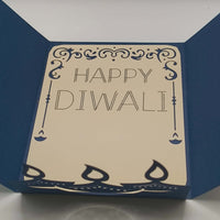 Handmade Diwali card with navy blue design and the greeting 'Happy Diwali' inside, perfect for festive celebrations.