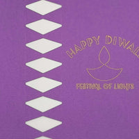 Purple cracker panel close-up showing gold foiled diya symbol with “Happy Diwali Festival of Lights” lettering.