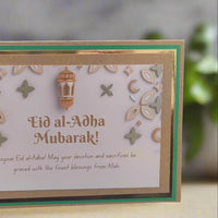 Handmade Eid al-Adha greeting card featuring elegant design and gold accents, perfect for sharing blessings.