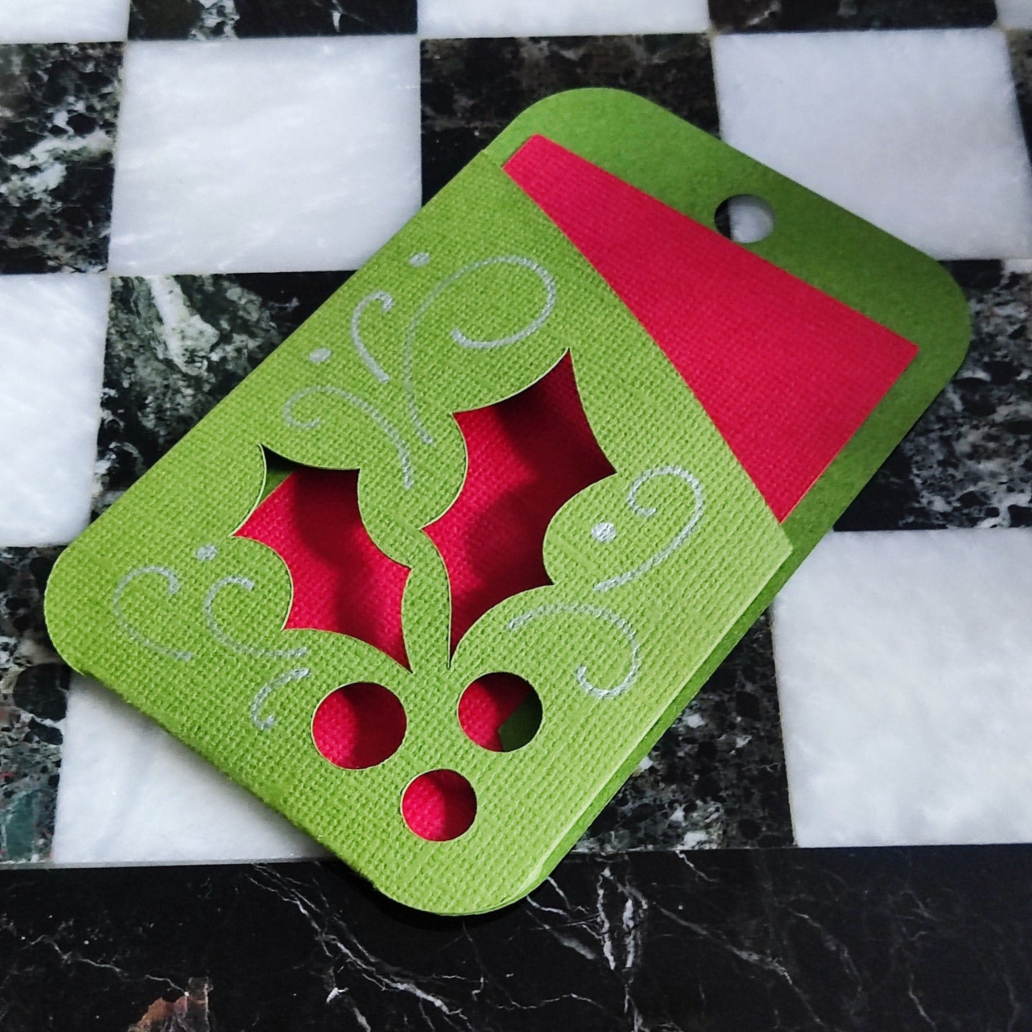 Holly gift card holder in green and red, featuring festive holly design, perfect for Christmas money envelope.