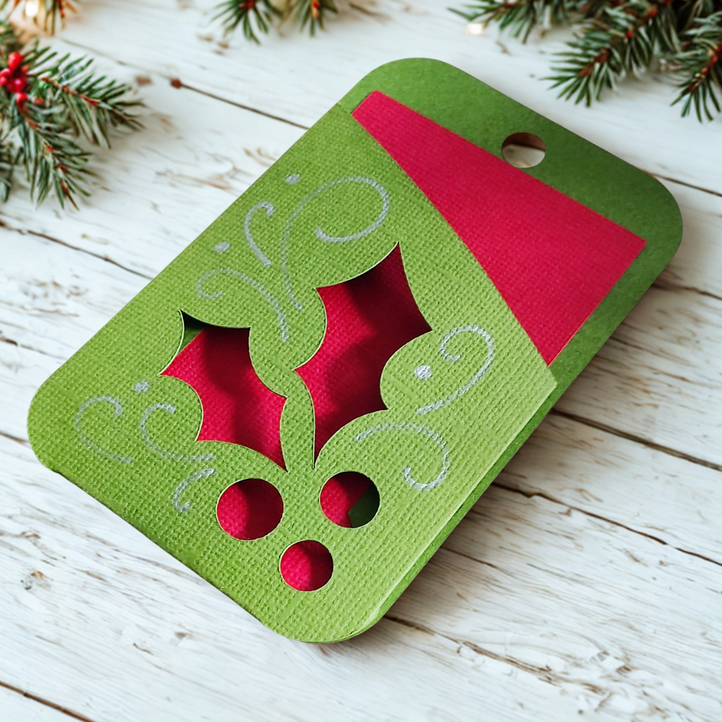 Holly gift card holder in green and red with decorative holly design, perfect for Christmas gift giving.