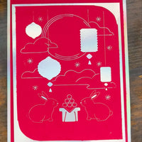 Handmade Mid-Autumn Festival card featuring red foil, moon rabbits, and floating lanterns on vibrant cardstock.