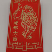 Red money envelope with full tiger illustration and Chinese characters drawn in gold pen