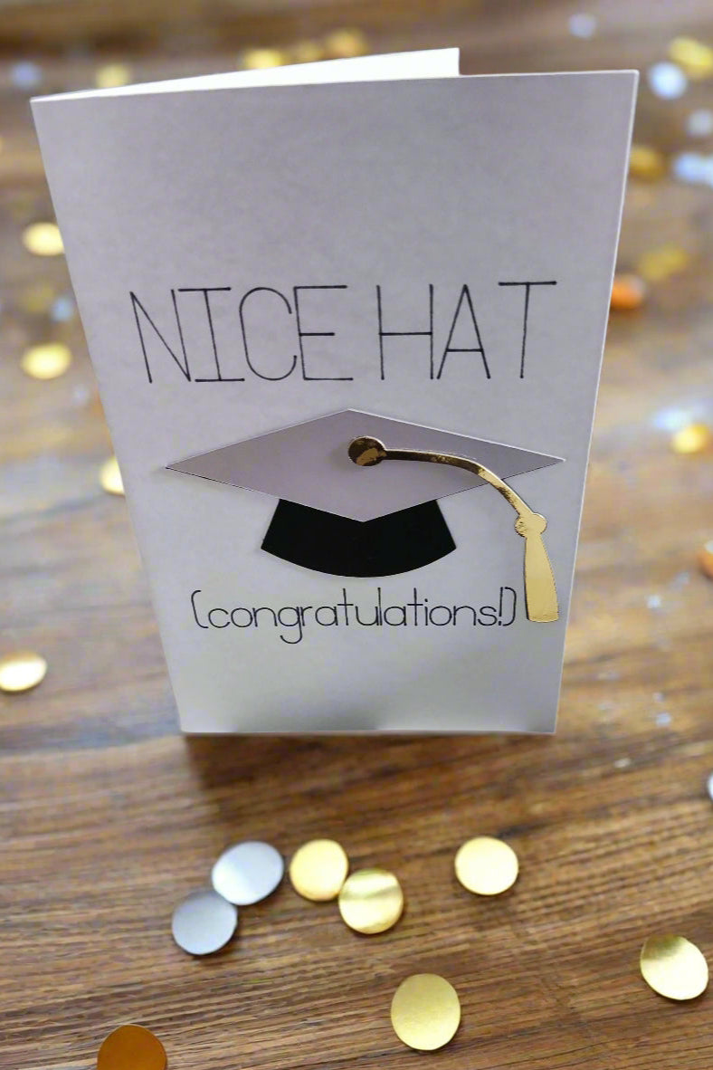 Funny handmade graduation card with 3D mortarboard cap, gold tassel, and "Nice Hat Congratulations" text.
