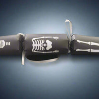 Black Halloween cracker with white skeleton design showing skull, ribcage, and legs tied with silver ribbon.