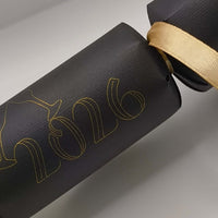 Personalised New Year cracker in black with gold 2026 design and ribbon, perfect for New Year celebrations.