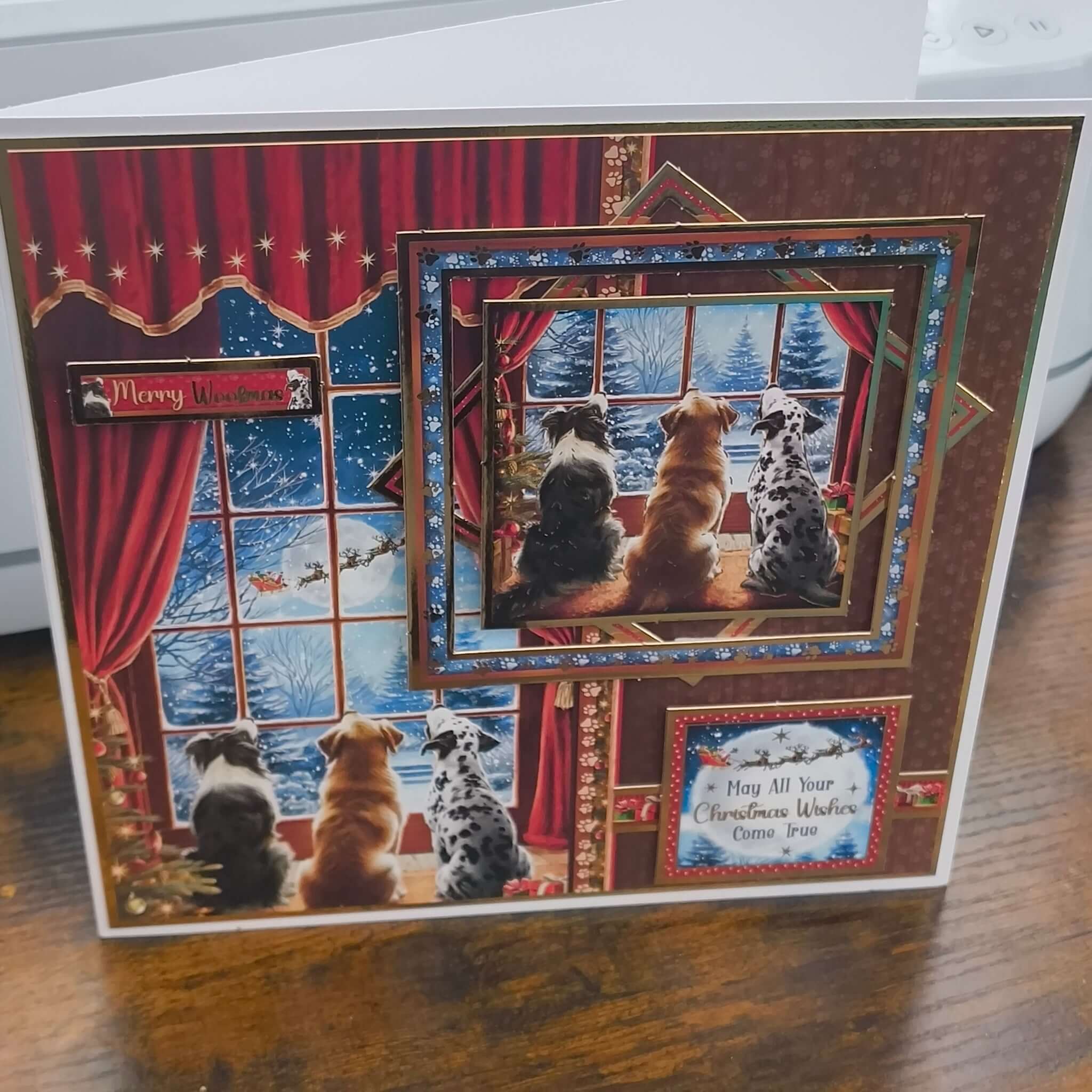 Festive 3D Christmas card with dogs by the window, red and gold accents, and snowy night scene.