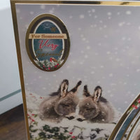 Close-up of Handmade Donkey Christmas Card featuring two donkeys in a snowy scene with gold foiling.
