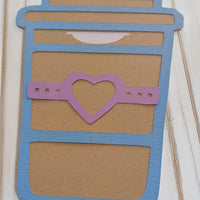 Coffee cup-shaped gift card holder with blue border and pink heart design, ideal for gifting vouchers or money.