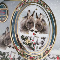 Handmade donkey Christmas card featuring two donkeys in a snowy scene with luxury gold foiling.