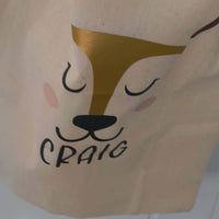 Personalised reindeer gift sack featuring gold foil design and the name 'Craig', perfect for Christmas gifts.