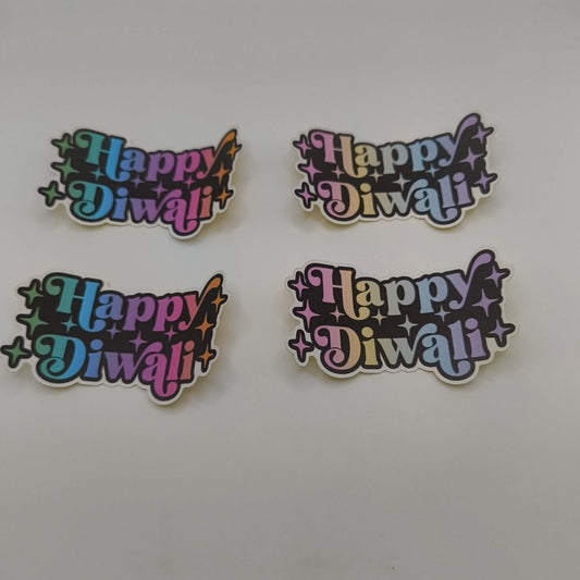 Set of four colourful “Happy Diwali” stickers in rainbow gradient designs with star accents displayed on a white background.