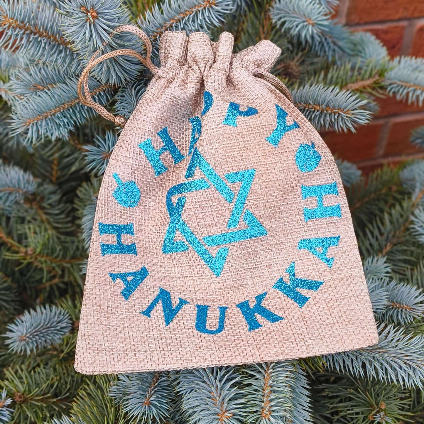 Hanukkah drawstring bag with a Star of David and festive design, perfect for celebrating the Festival of Lights.