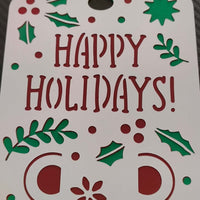 Handmade Happy Holidays money holder card with festive cut-out design in red and green.