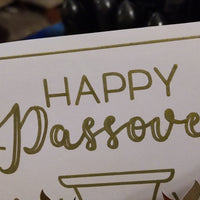 Zoomed-in view of “Happy Passover” lettering in metallic gold foil. Shows fine detail and high-quality printing on smooth white card.