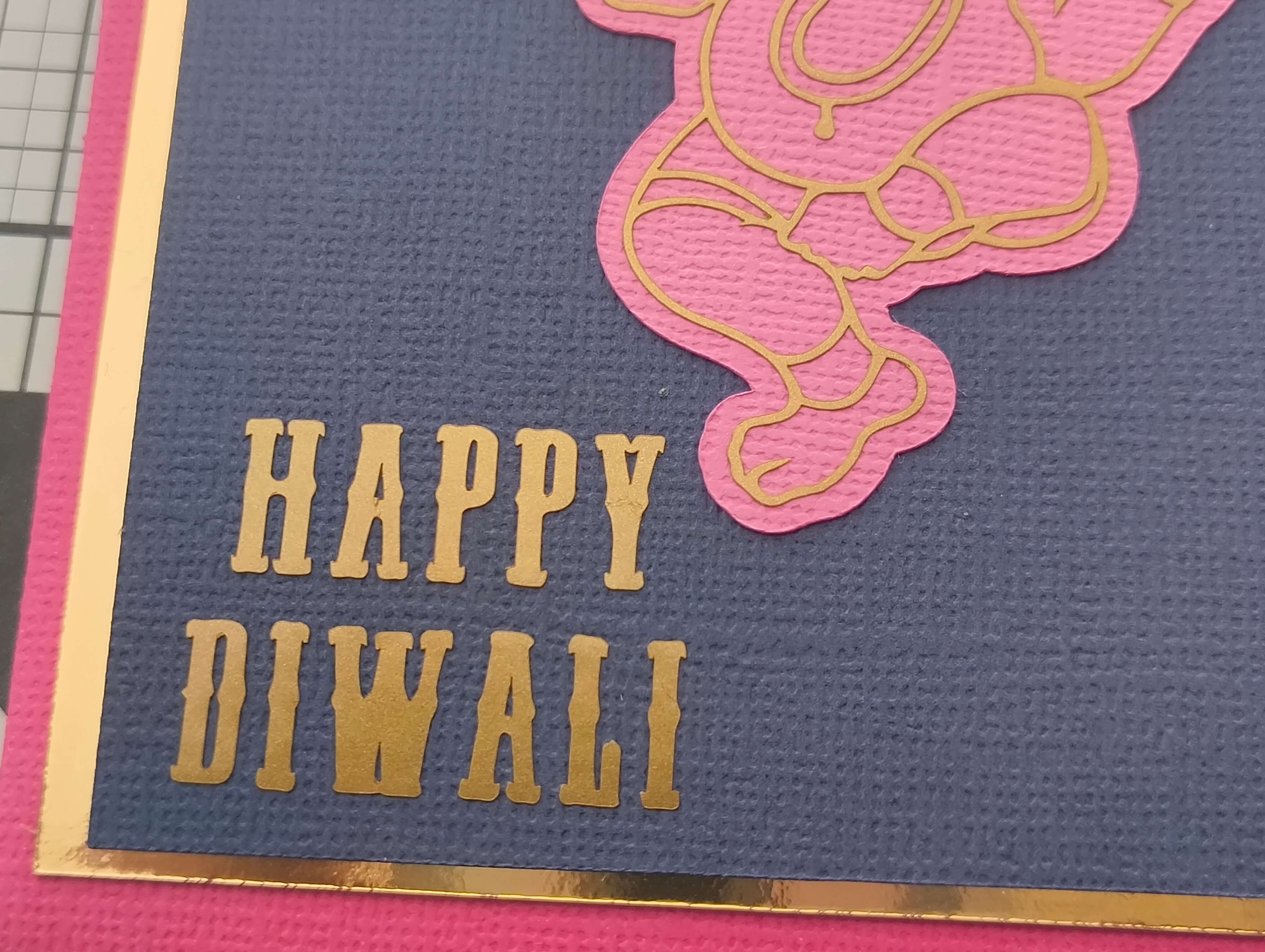 Personalised Diwali envelope featuring a Happy Diwali message with Ganesha design in gold and pink colors.