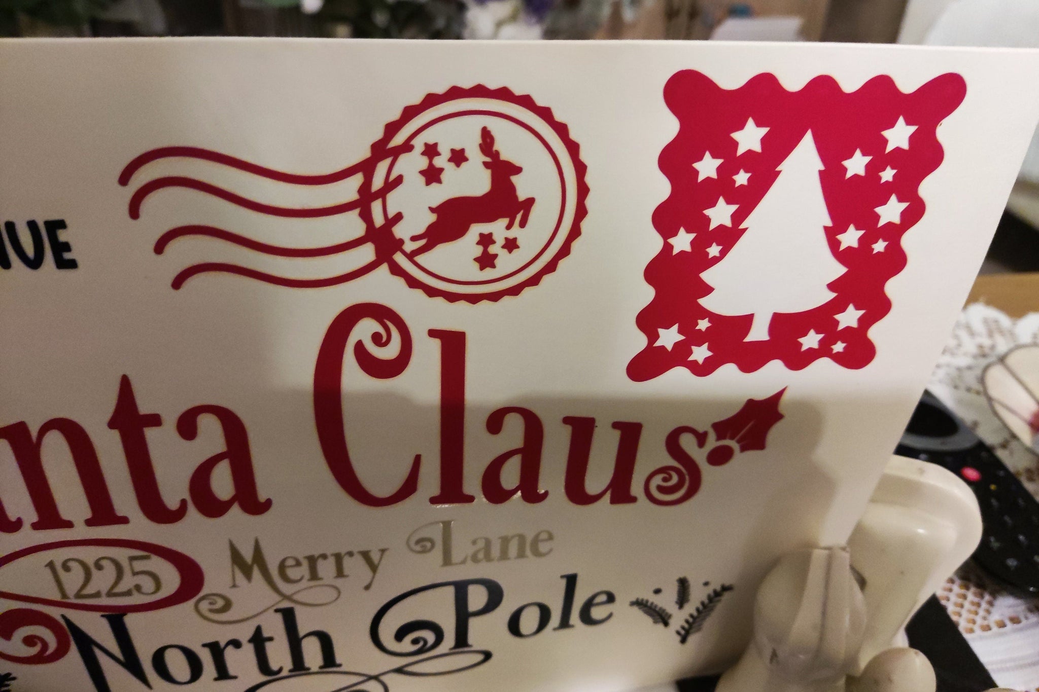 Personalised Santa Claus Envelope design featuring reindeer, Christmas tree, and North Pole address details.