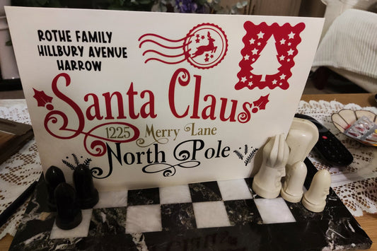 Personalised Santa Claus Envelope featuring family name and North Pole address design.