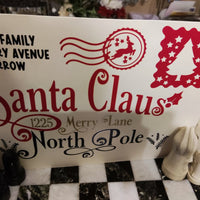 Personalised Santa Claus Envelope featuring family name and North Pole address design