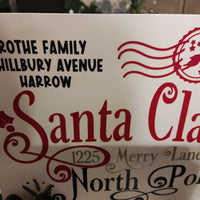Personalised Santa Claus Envelope featuring Rothe Family and North Pole address design.