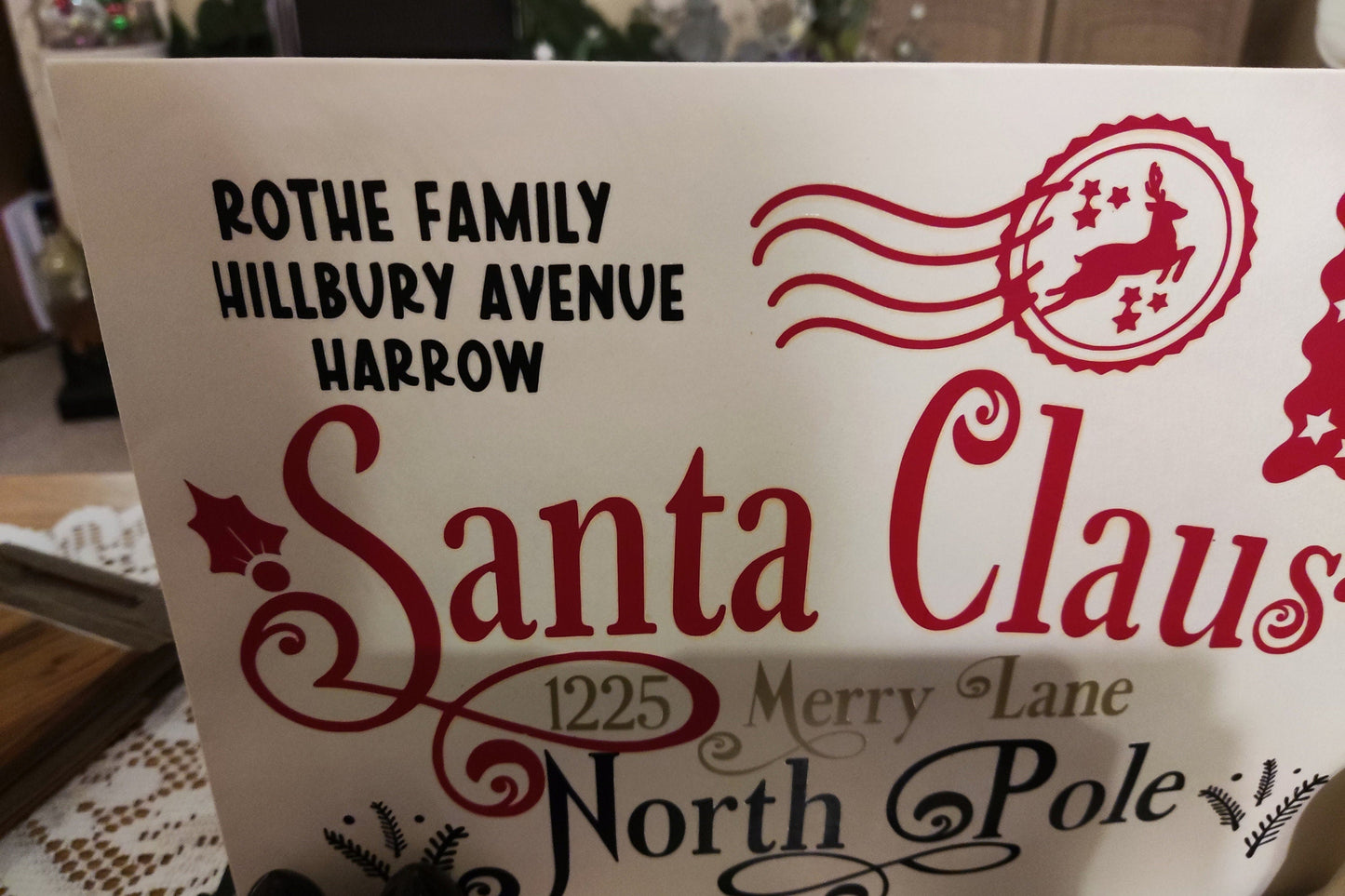 Personalised Santa Claus Envelope featuring Rothe Family and North Pole address design.