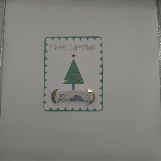 Inside of handmade Christmas card featuring green glitter tree money holder with space for a banknote gift.