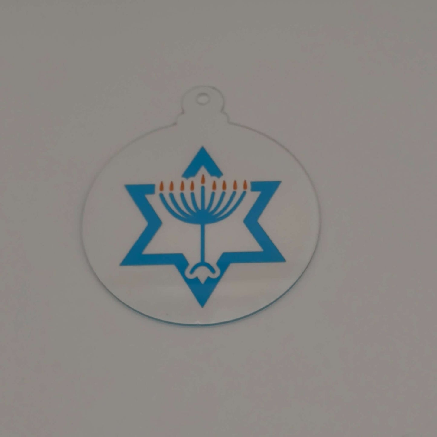 Jewish holiday acrylic hanging decoration featuring menorah inside Star of David.