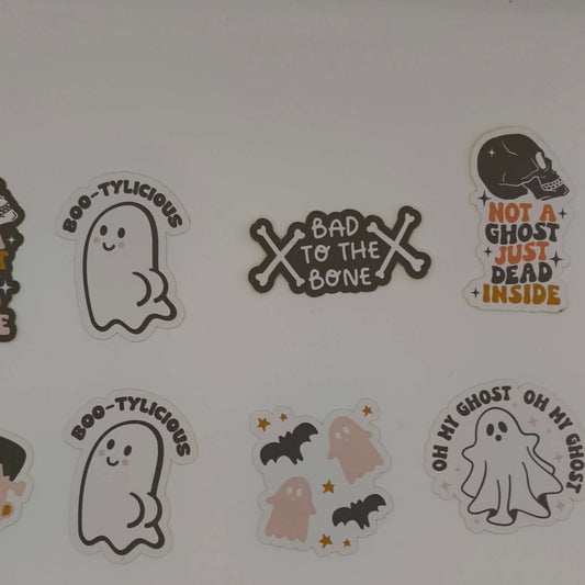 Loose Halloween stickers displayed on white background including “Bad to the Bone”, pink bats, “Oh My Ghost”, and “Not a Ghost Just Dead Inside”.