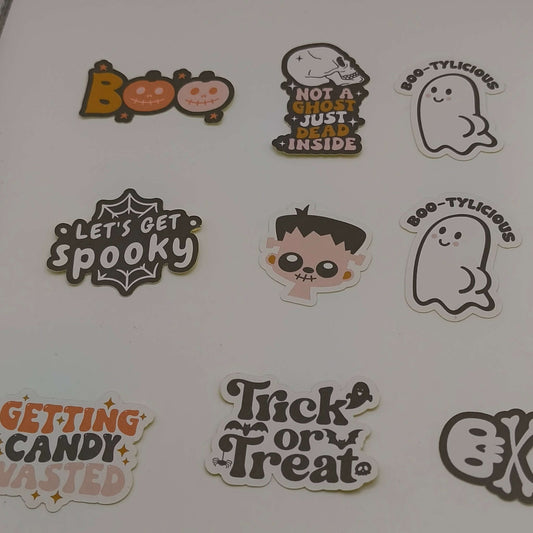 Loose Halloween stickers featuring designs like “Boo”, “Not a Ghost Just Dead Inside”, “Let’s Get Spooky”, “Trick or Treat”, and cute ghost characters.
