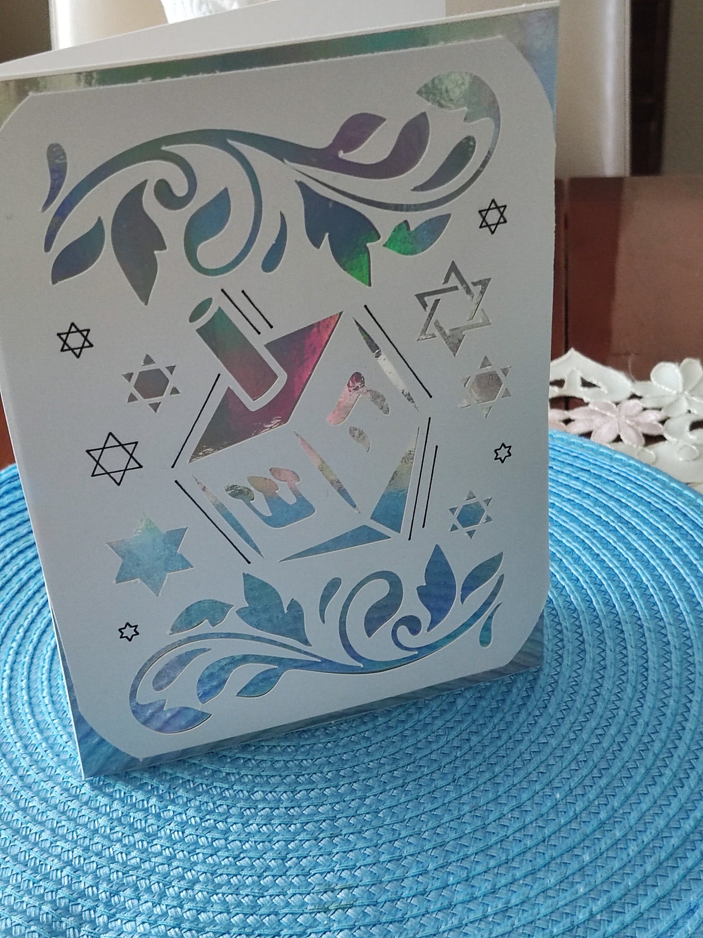 Luxury handmade Hanukkah card with dreidel design and Star of David cut-outs