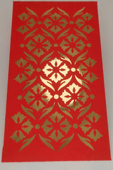 Close-up of luxury red envelope with gold foil cut-out floral pattern