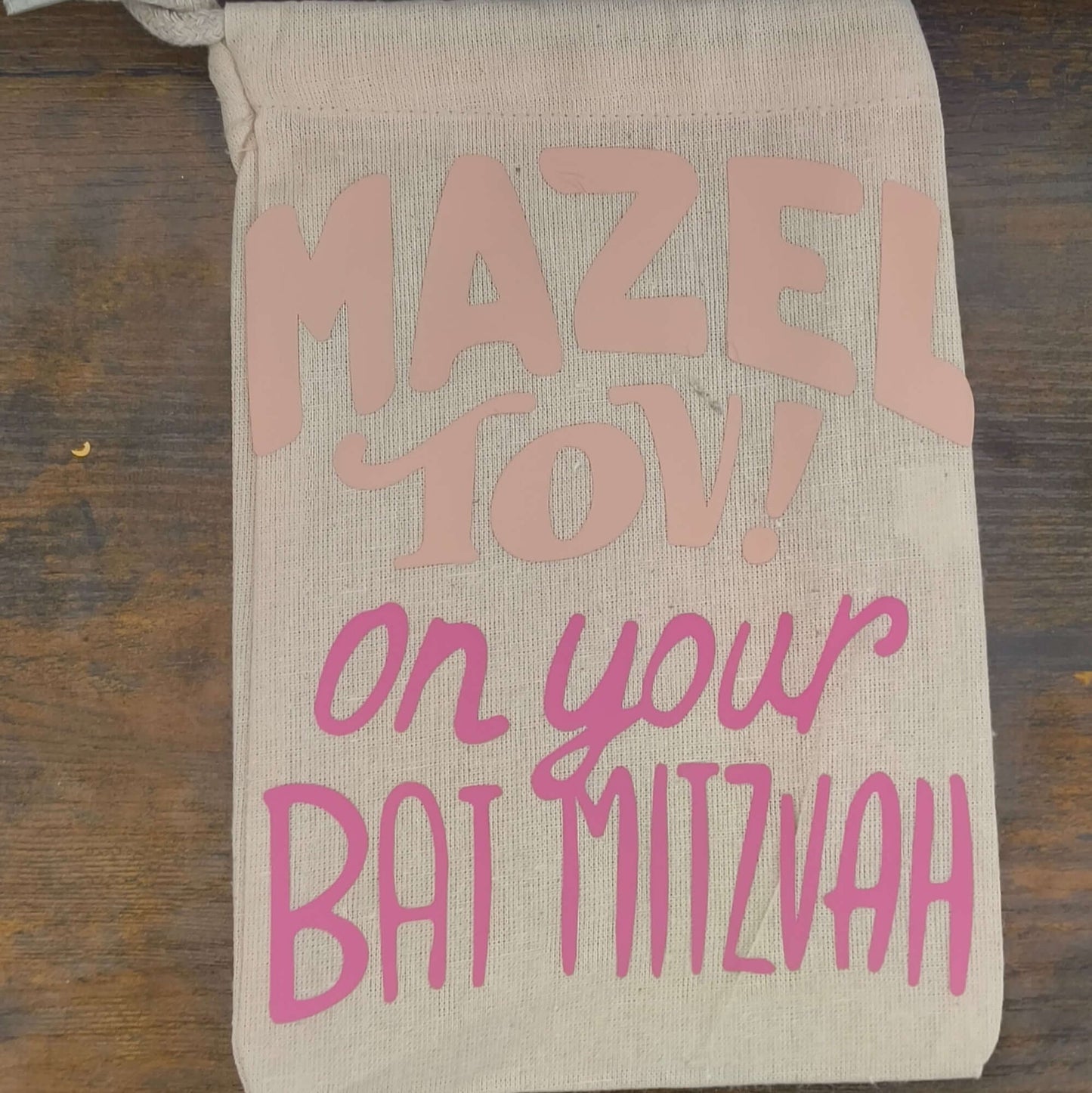 Personalised Bat Mitzvah gift bag in natural hessian with pink vinyl lettering reading 'Mazel Tov! on your Bat Mitzvah'