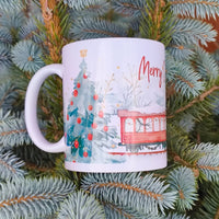 Close view of Merry Christmas mug with festive train illustration