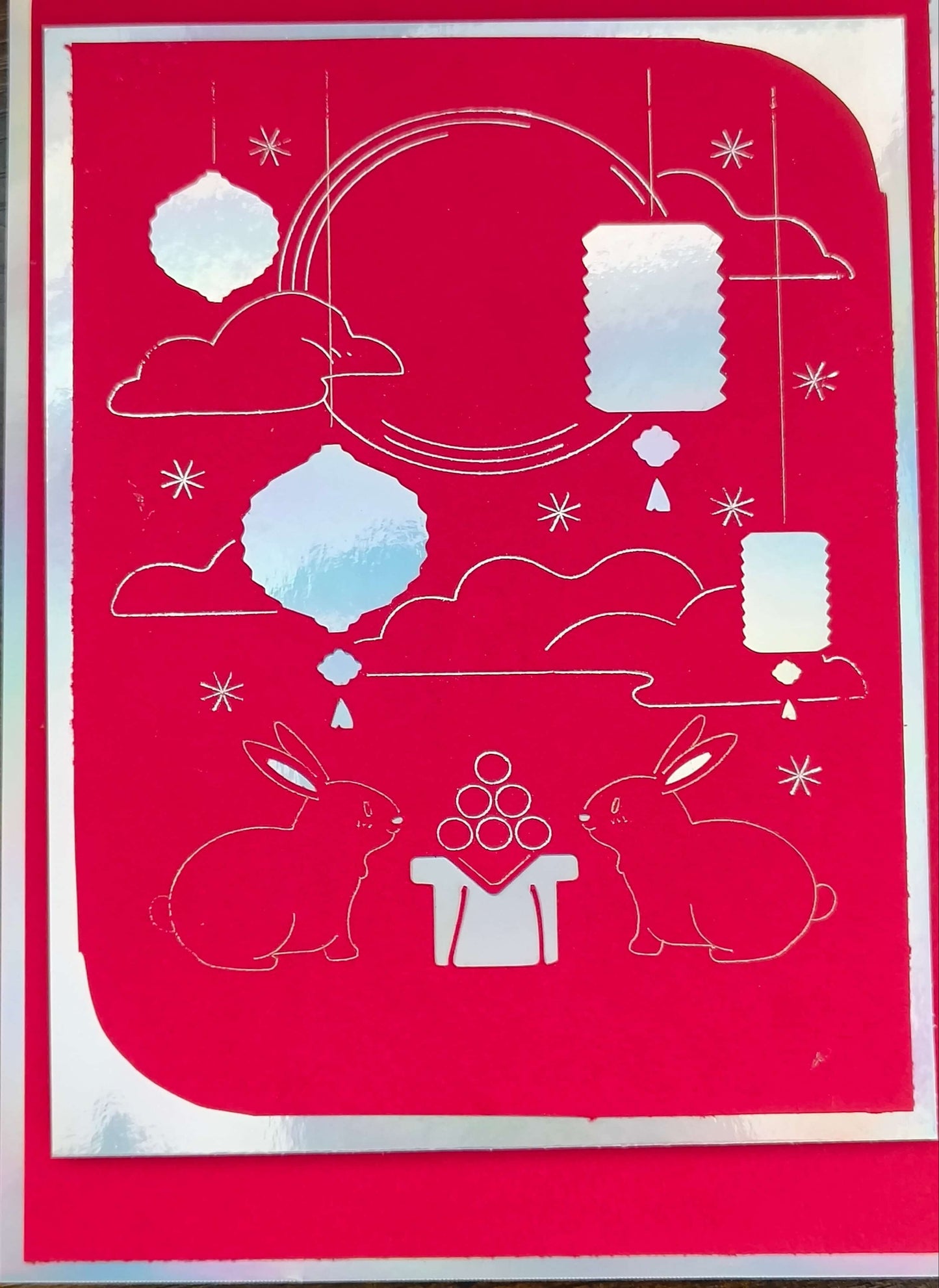 Handmade red foil Mid-Autumn Festival card featuring moon rabbits, lanterns, and a celestial backdrop.