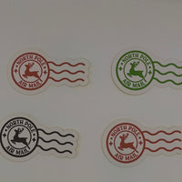 Round North Pole Air Mail stickers in black, red, and green with wavy lines.