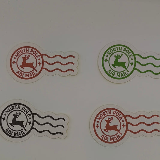 Round North Pole Air Mail stickers in black, red, and green with wavy lines.