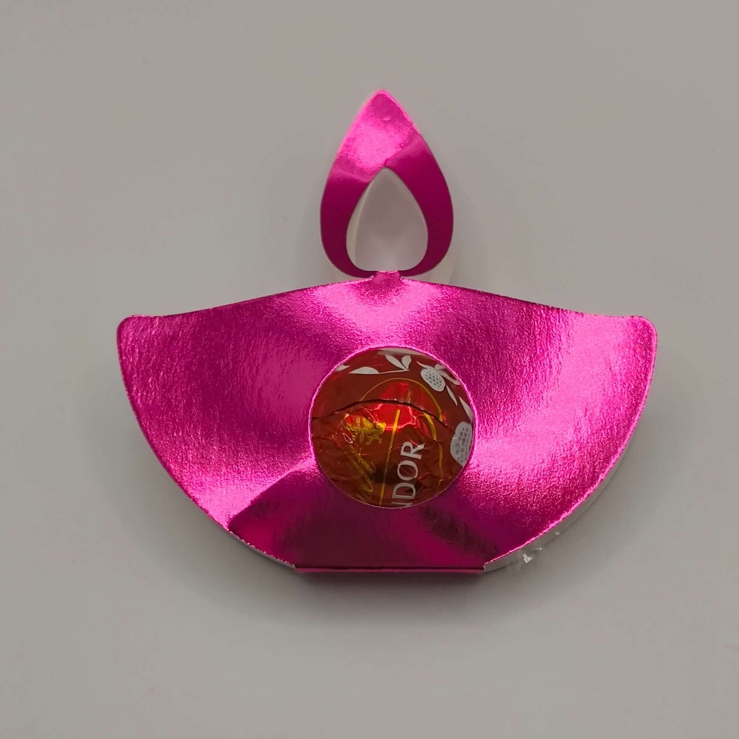 Pink metallic diya favour for Diwali, ideal for holding sweets and gifts, with a shiny finish.
