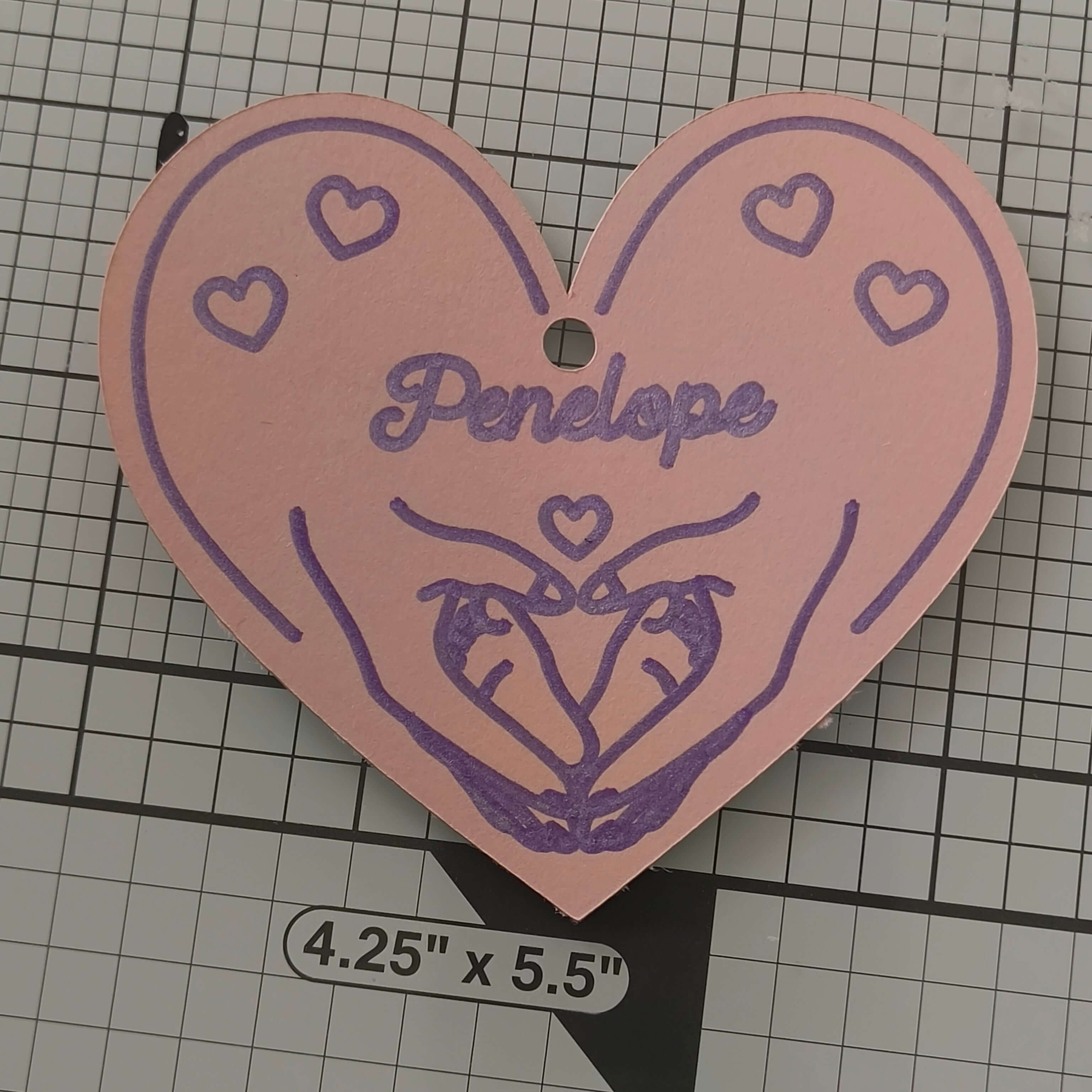 Personalised heart gift tag featuring hands and hearts, named 'Penelope', perfect for baby gifts.