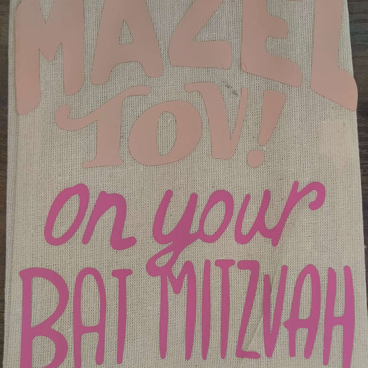 Handmade Bat Mitzvah gift bag featuring 'Mazel Tov!' and 'On Your Bat Mitzvah' in pink vinyl.