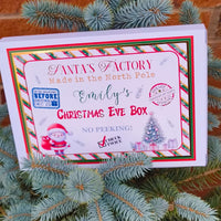 Personalised Christmas Eve Box with Santa design, featuring a festive label and Christmas decorations.