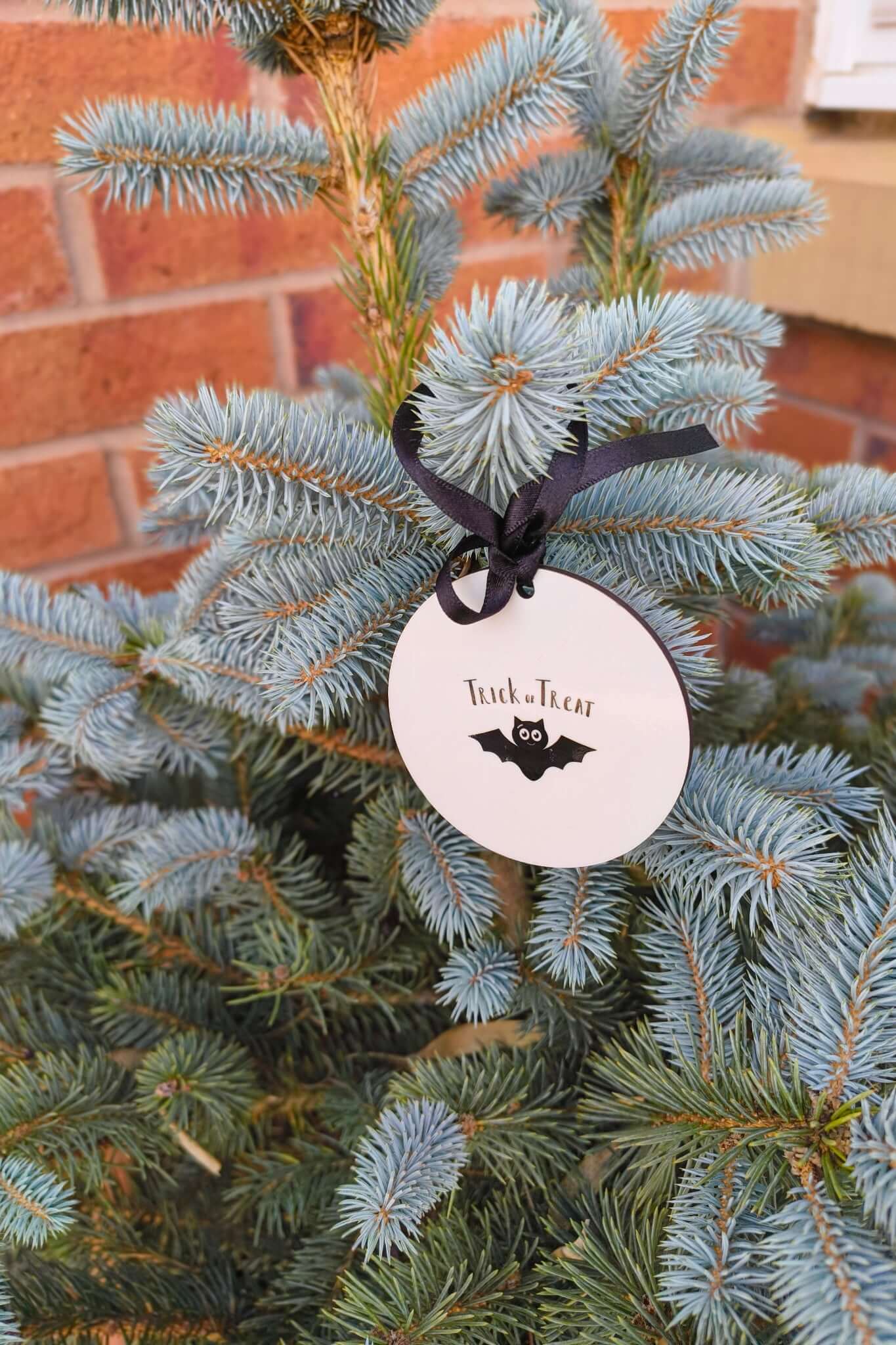 Personalised Halloween bauble with bat design and black ribbon, Trick or Treat hanging decoration.