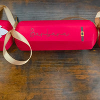 Personalised red Christmas cracker featuring a Santa design and gold ribbon, customised with the name Barbara.