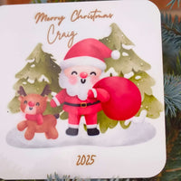 Detailed view of personalised Santa coaster with name Craig and year 2025, showing festive design with reindeer and Christmas trees.