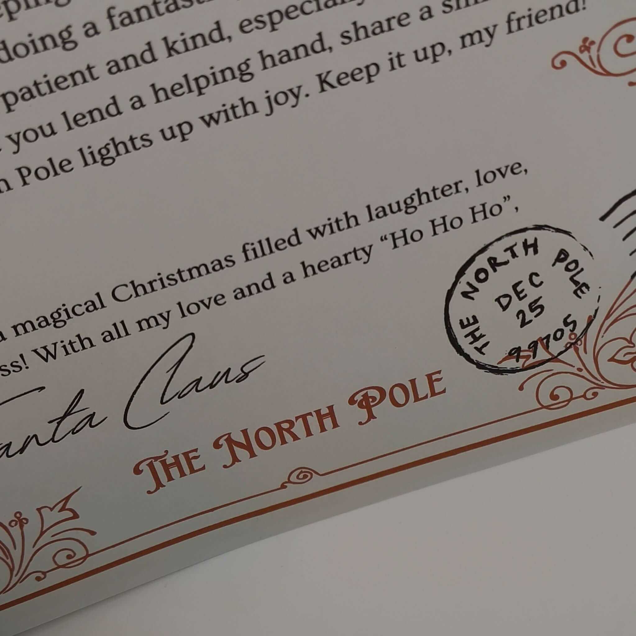 Close-up of a personalised Santa letter with a North Pole postmark, perfect for Christmas keepsake.