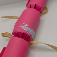 Elegant pink handmade cracker with vintage-inspired design and personalised name text in gold foil