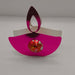 Pink metallic diya favour holding a chocolate, perfect for Diwali celebrations and party gifts.