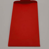 Back of red Chinese New Year envelope with flap open for inserting notes or gifts.