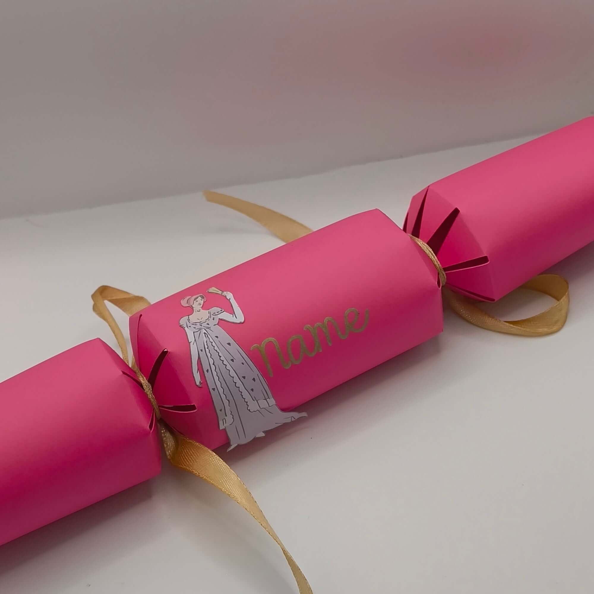 Personalised Regency style pink crackers with gold ribbon and vintage design, perfect for themed parties.