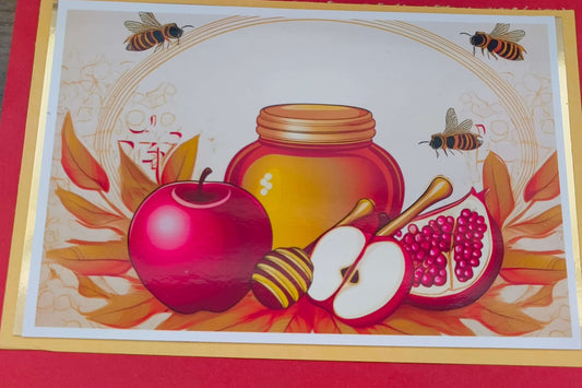 Rosh Hashanah card design featuring honey, apples, and pomegranates symbolising the Jewish New Year.