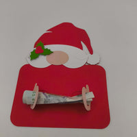 Red Santa money holder card with a £5 note rolled and slotted into the paper cut-outs, creating a festive handmade gift presentation.